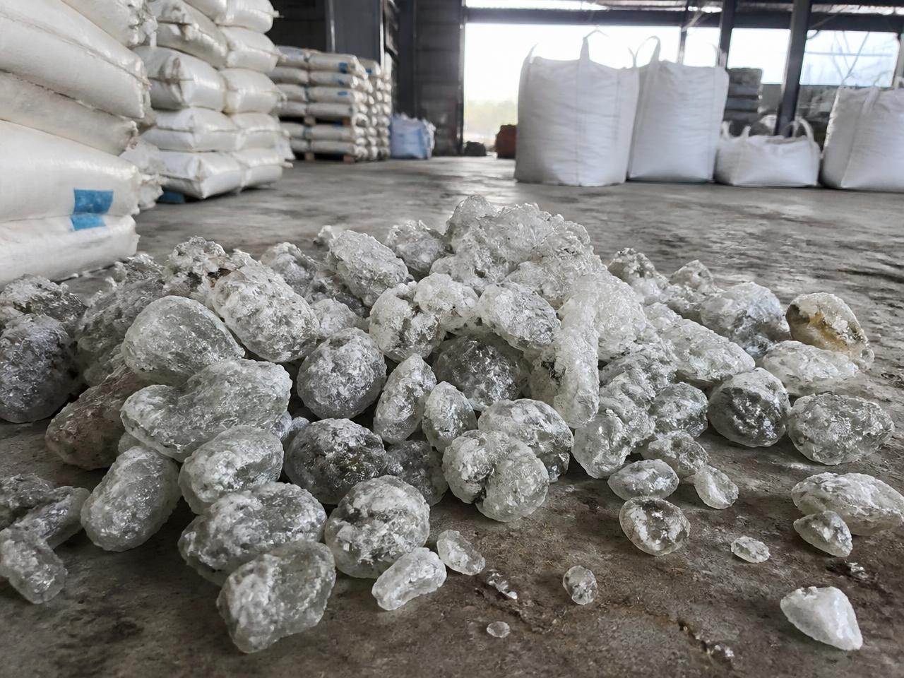 Recycled PET lumps stored in an industrial warehouse ready for bulk export supply